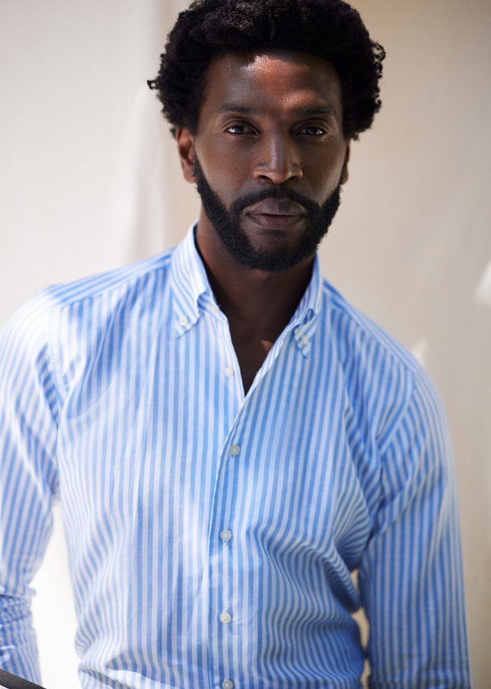 man in a blue and white striped shirt