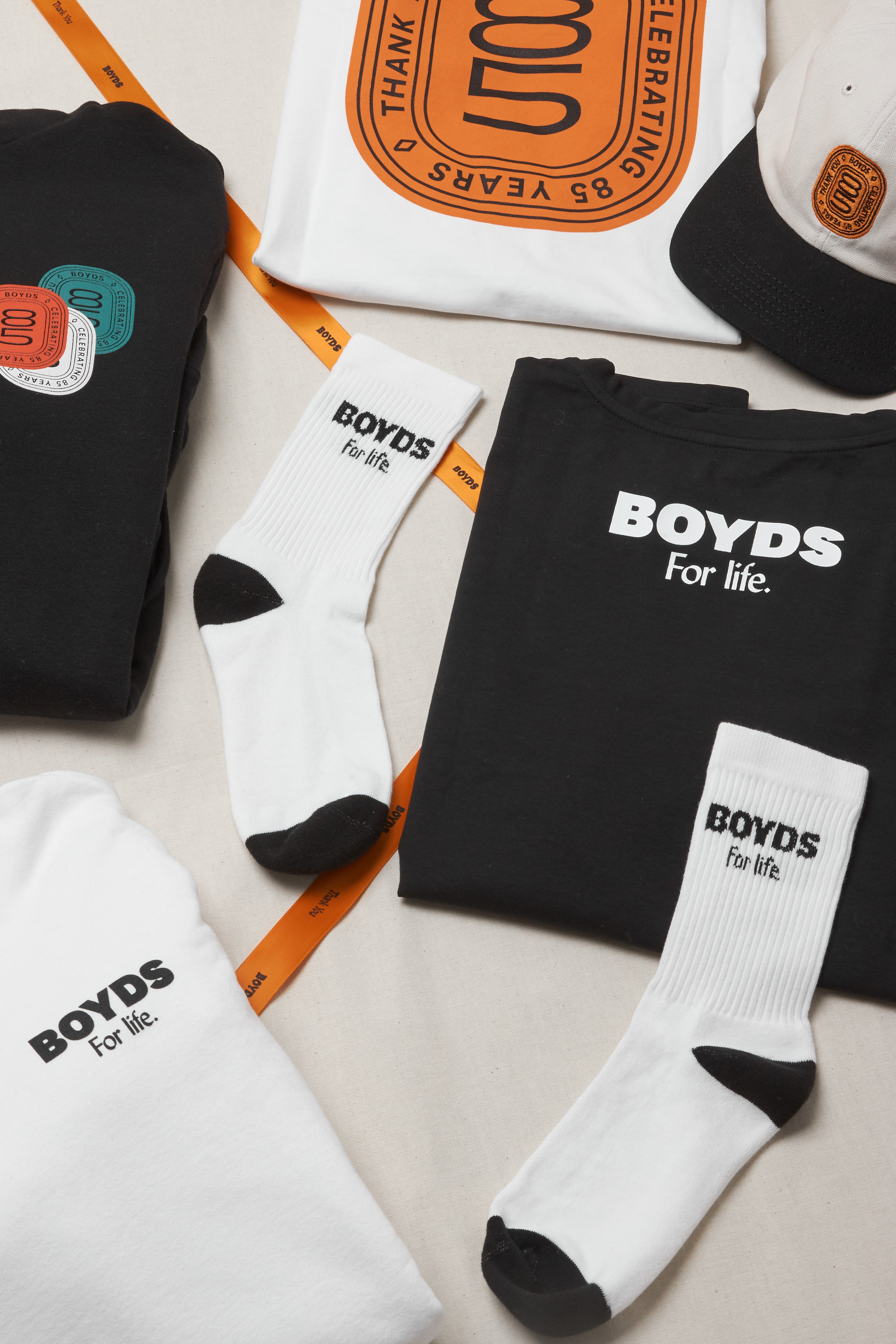 Overhead shot of Boyds' 85th Anniversary merchandise & ribbon