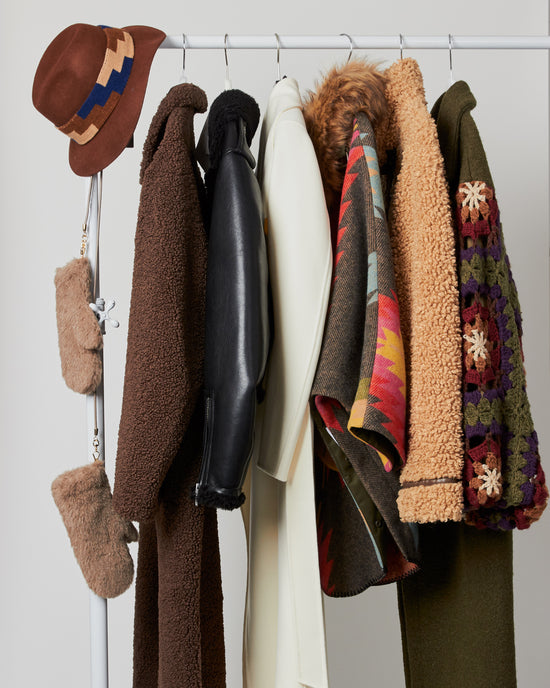 rack of winter coats & accessories