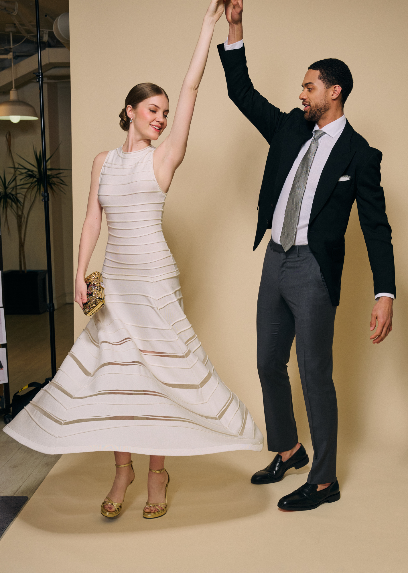 Models 'twirling' in wedding looks.